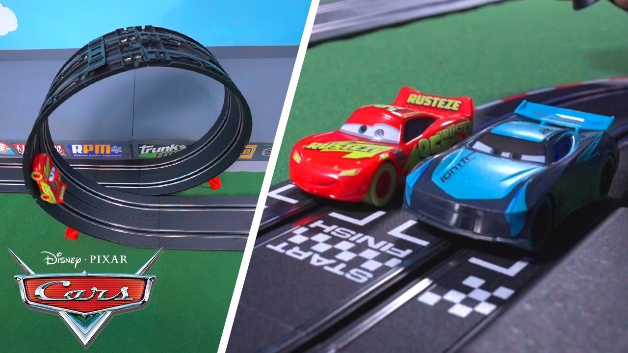 Lightning McQueen Challenges Jackson Storm on a Gravity Defying Loop! | Pixar Cars | @disneyjr