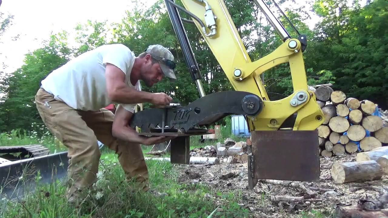 Mini excavator with mechanical wood splitter.....is it worth it?