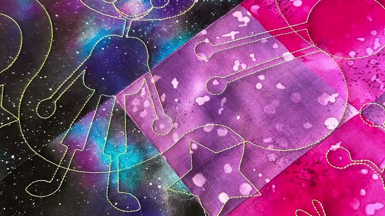 A panel quilt customized using a pantograph