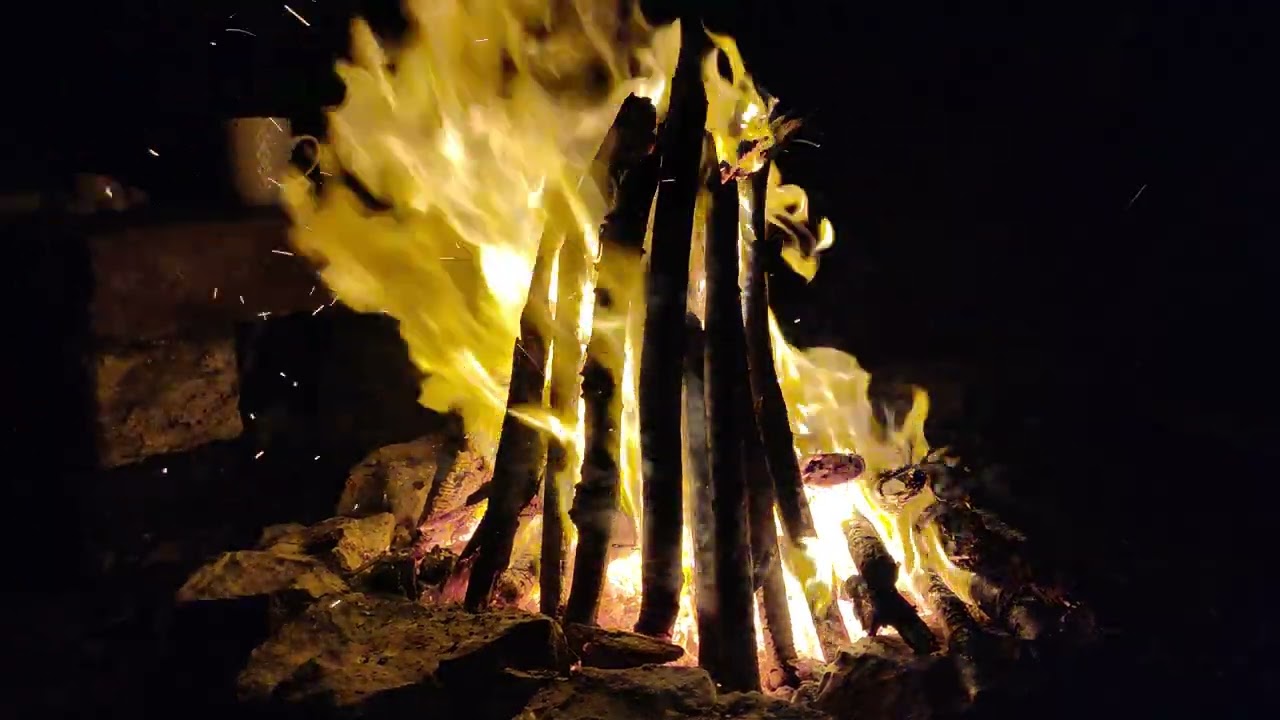 Relaxing fire cracking sounds with sea waves in a distance on deserted island in the night