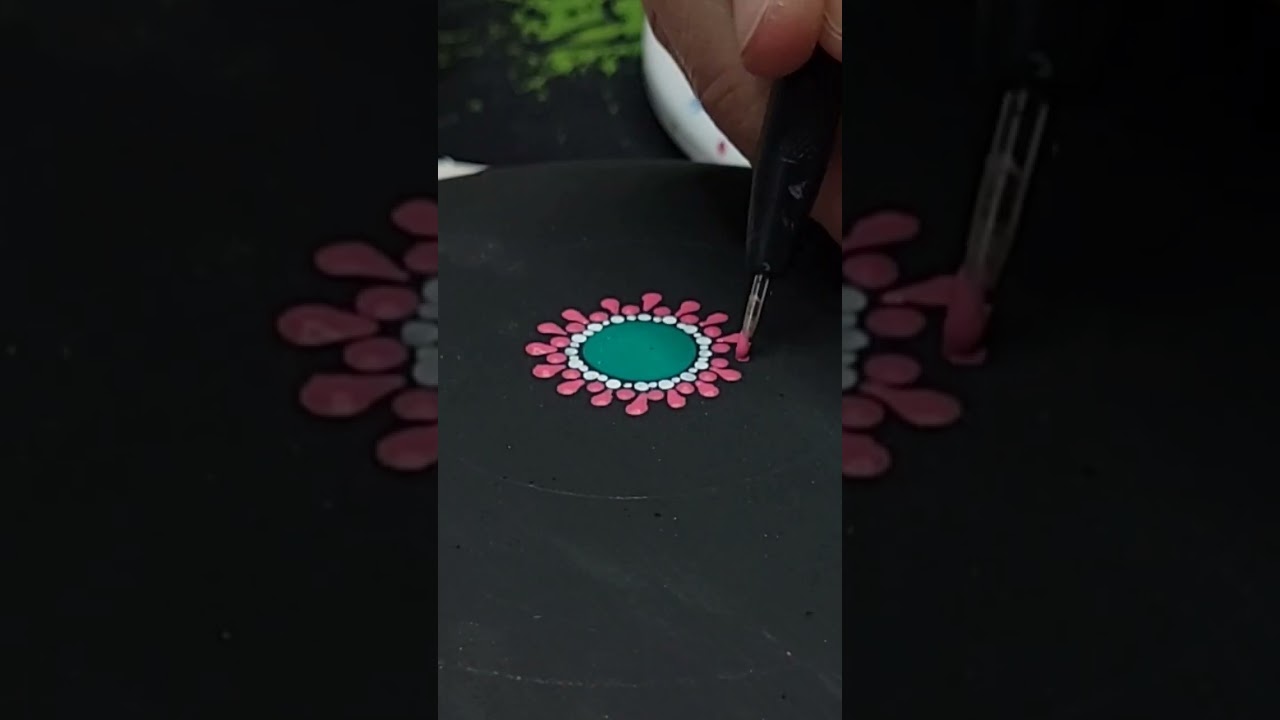 Short: Sneak peek of an up coming Spring Mandala painted on a handmade stone by Miranda pitrone