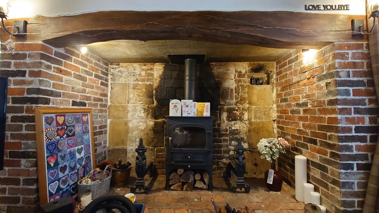 SWEEPING A CLEARVIEW VISION 500 WOOD BURNING STOVE IN A STUNNING INGLENOOK.