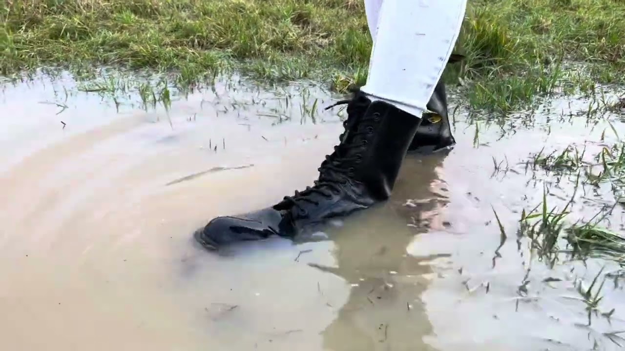 Dr Martens boots get wet exploring puddles in a field