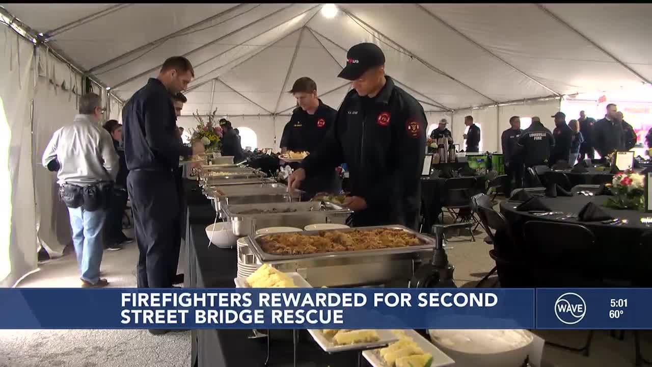 Firefighters treated with food after rescuing semi driver dangling off 2nd Street Bridge