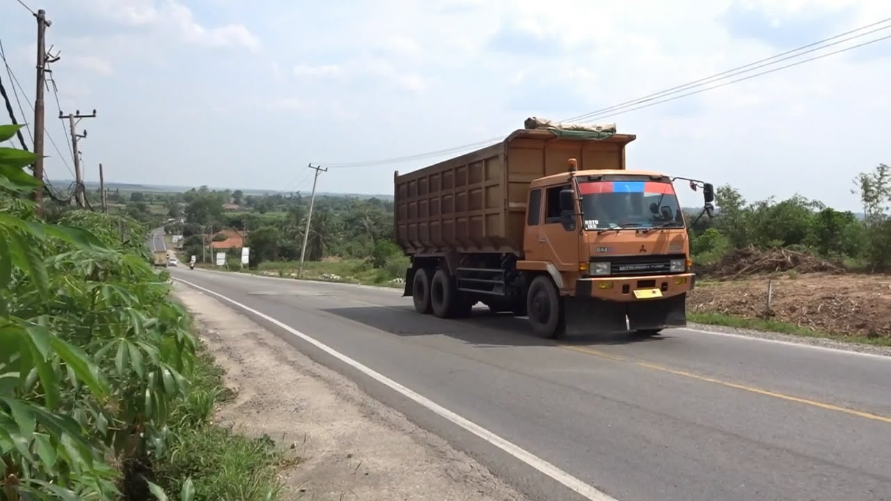 Hino and Mitsubishi Fuso Dump Truck On Climb High Hill