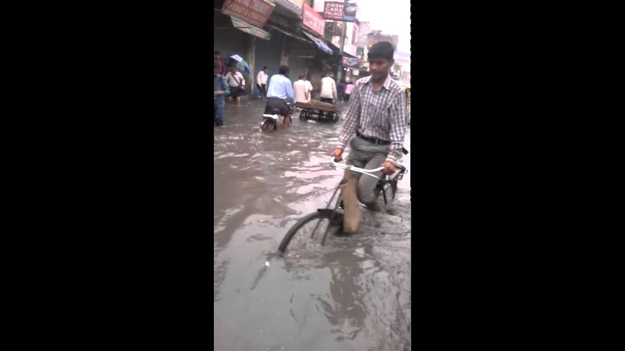 Sangam vihar rain after road side