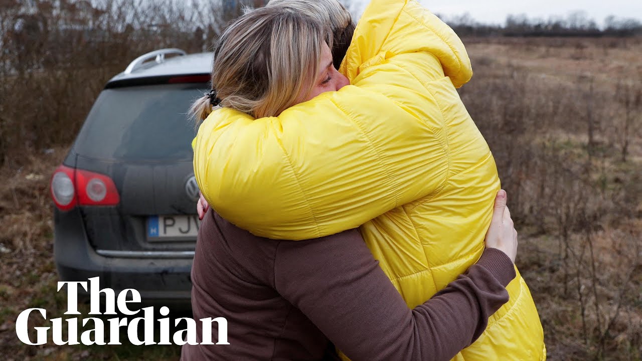 Ukrainian mother hugs her children brought to safety by a stranger