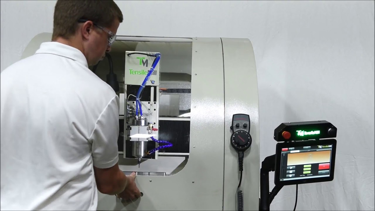 Loading and Unloading Fixture for Tensile Specimen Preparation   TensileMill CNC, Inc