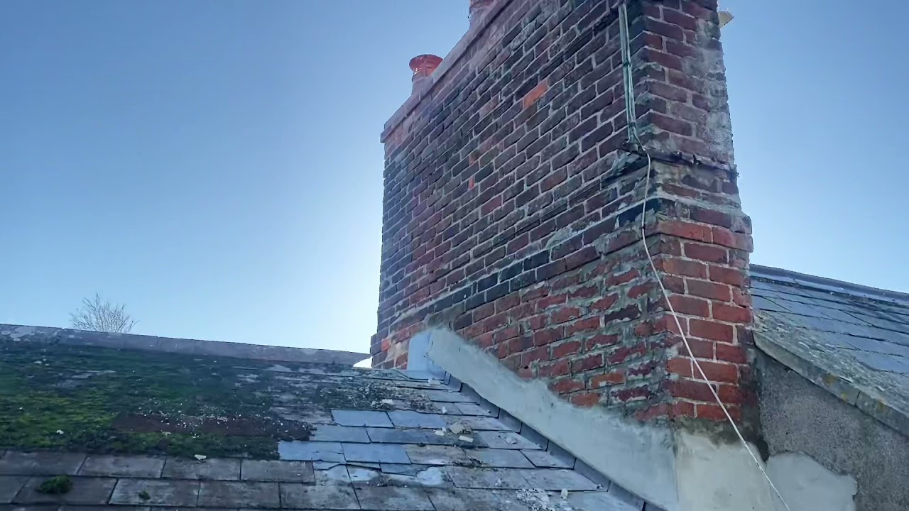 Scraping a roof full of moss