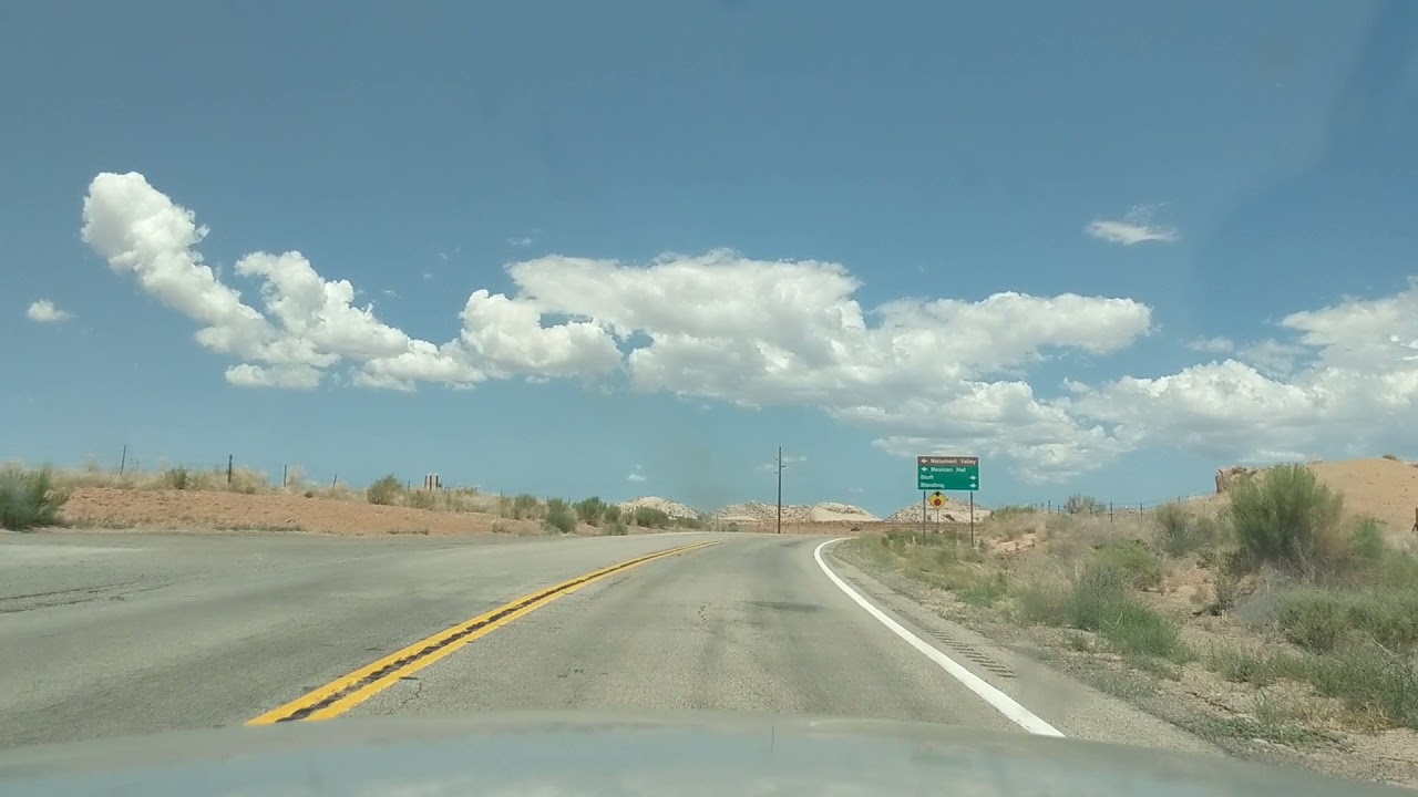 Arizona Drive: US Route 160 rock formations and desert  in a Crown Victoria