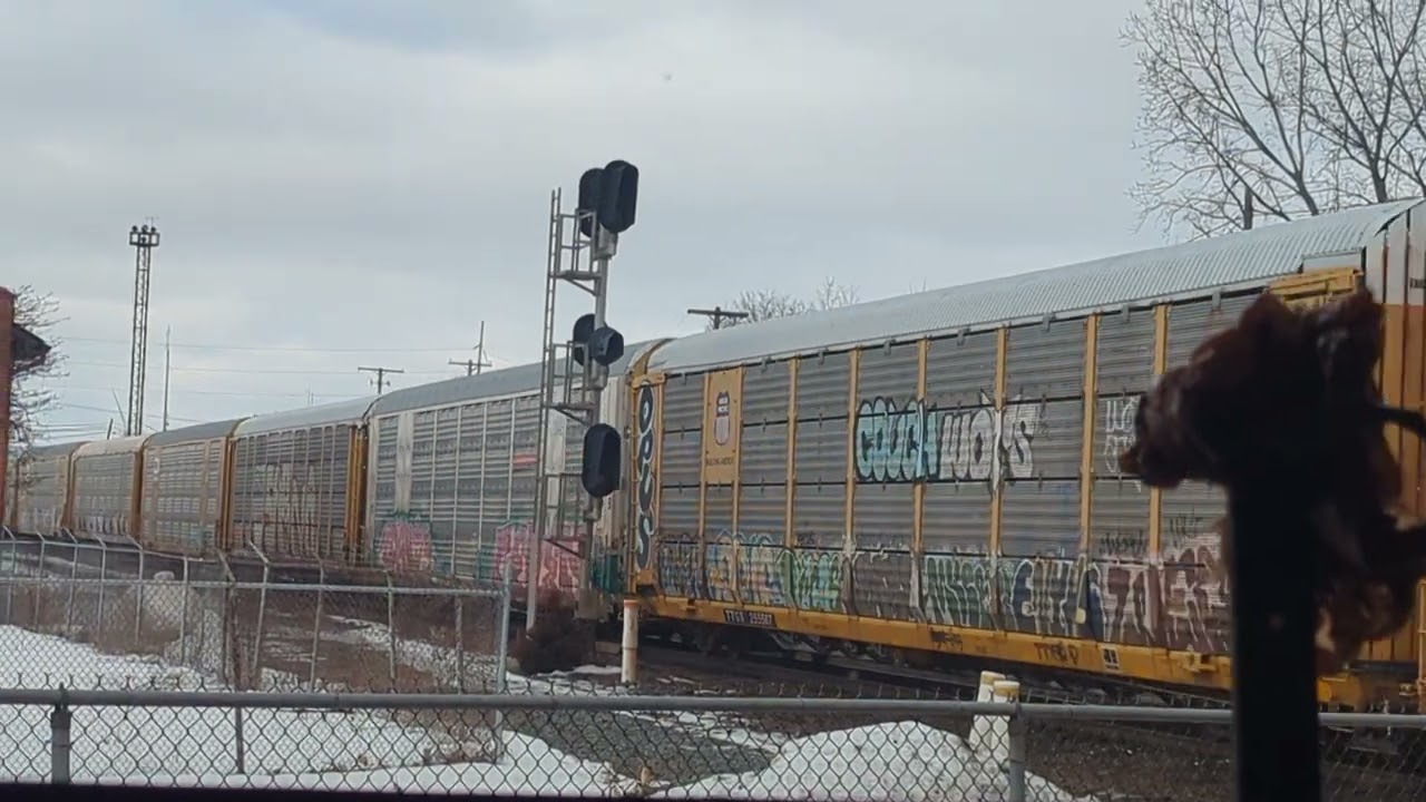 Long CSX auto rack train heading west 
