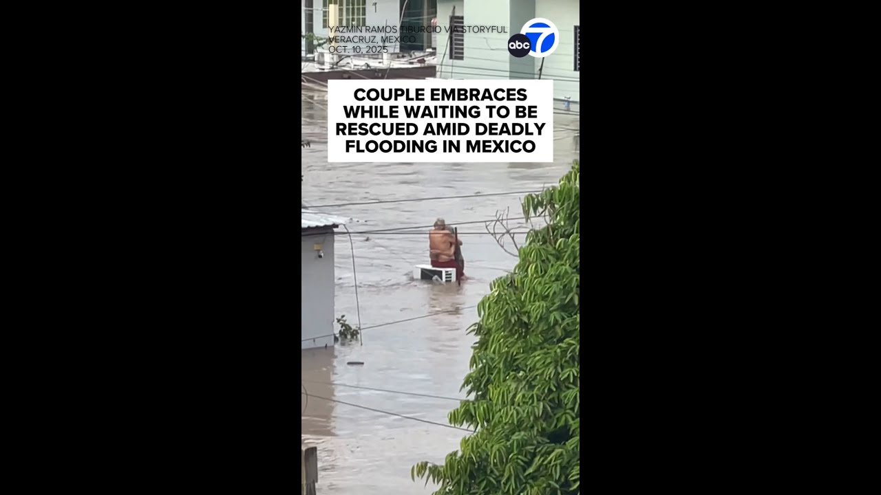 Couple embraces while waiting to be rescued amid deadly flooding in Mexico
