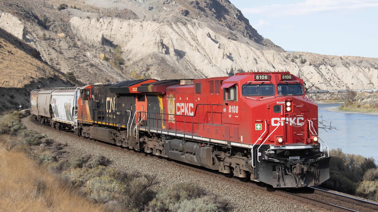 CPKC stack train with CN locomotive curving through the Thompson Canyon!