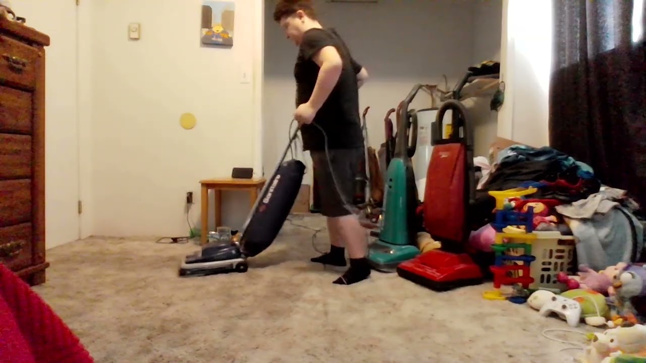 vacuuming the bedroom with 2008 sanitaire s647 type e