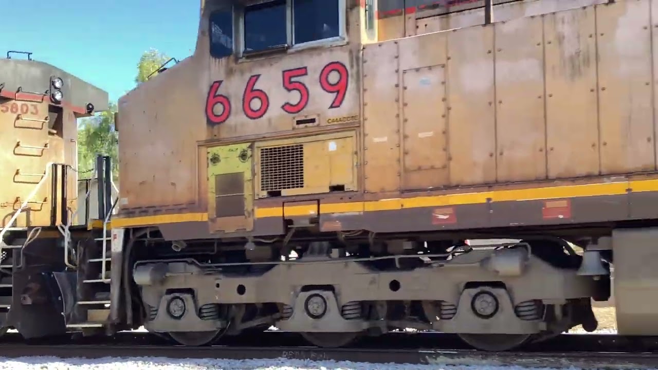 UP 5803 leads a Light move through Tempe AZ passing 10th Street crossing