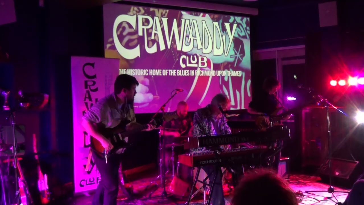 Adam Pyke (bass guitar & lead vocals) on “Tainted Love” accompanied by Alex Voysey for Burning Rope