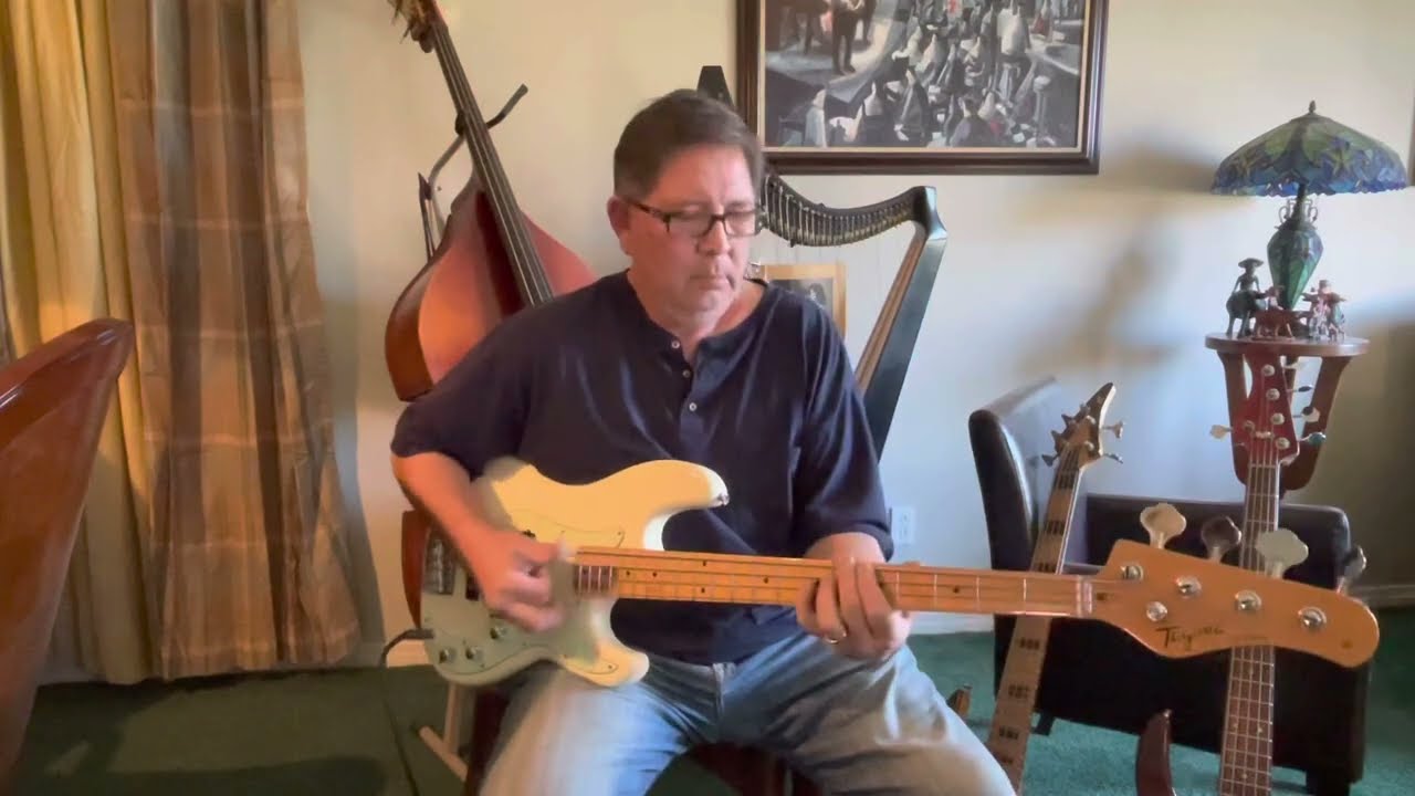 JD demos a Tagima TW65 PJ type bass