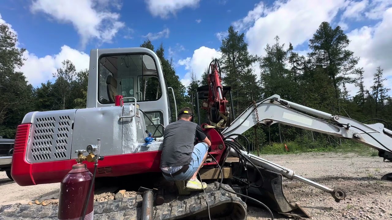 Installing king pin bushings and washers on Excavator