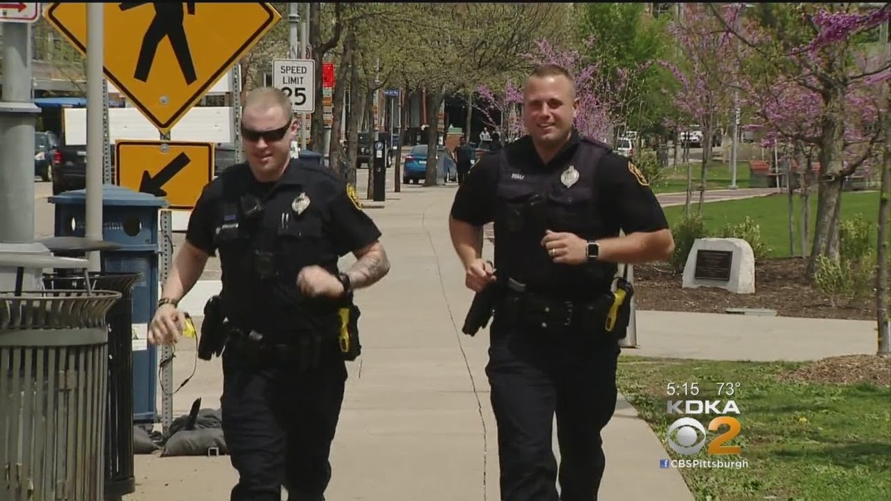 Officers Running In Full Gear During Marathon