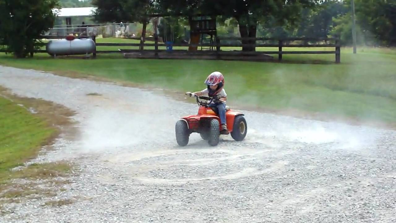3 year old on 4 wheeler doing brodies