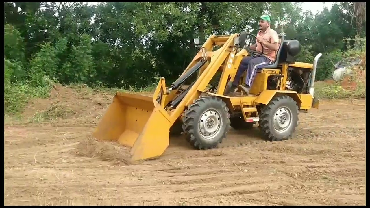 pá carregadeira caseira trabalhando