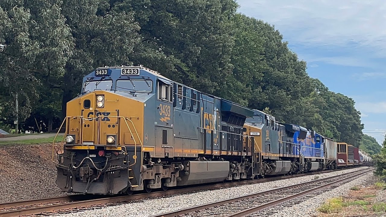 CSX 3433 pulls a very large M582 with though we are one heritage in trail 8-3-2025￼￼￼