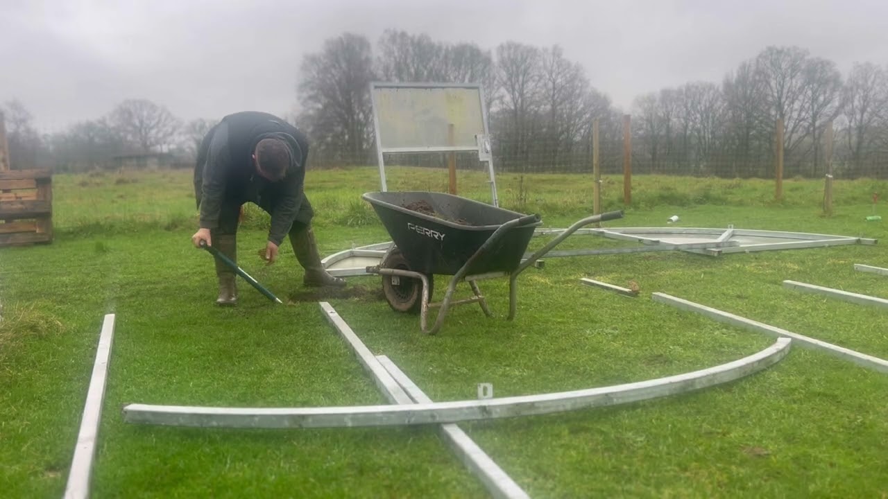 up cycling a bike shelter to a poly tunnel