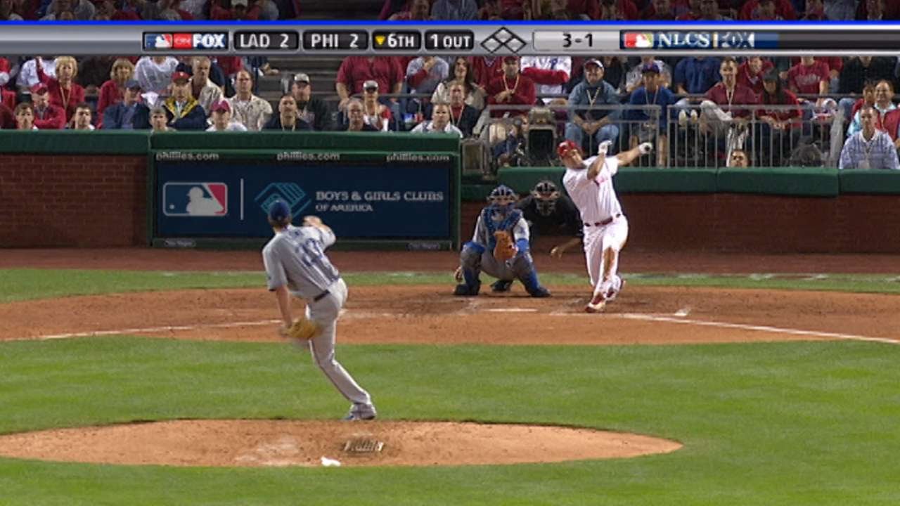 Burrell rounds the bases with a solo homer
