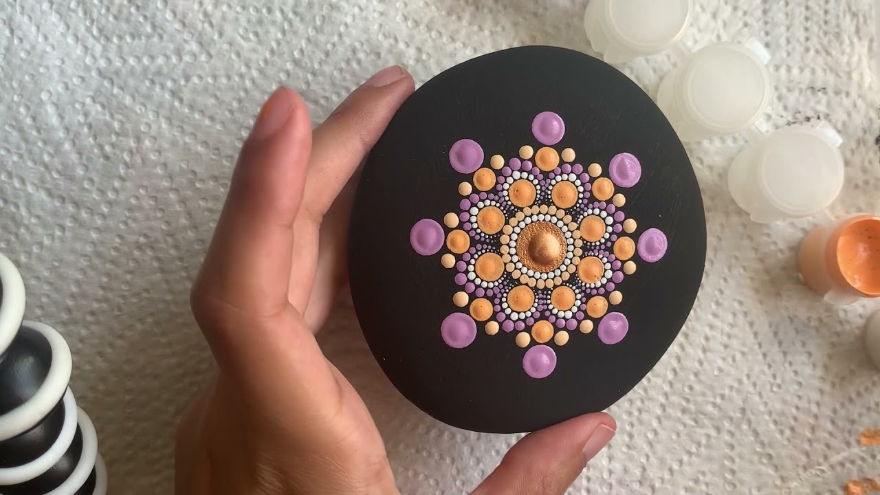 Step-by-step dotted mandala painted onto a rock using Rock Paint