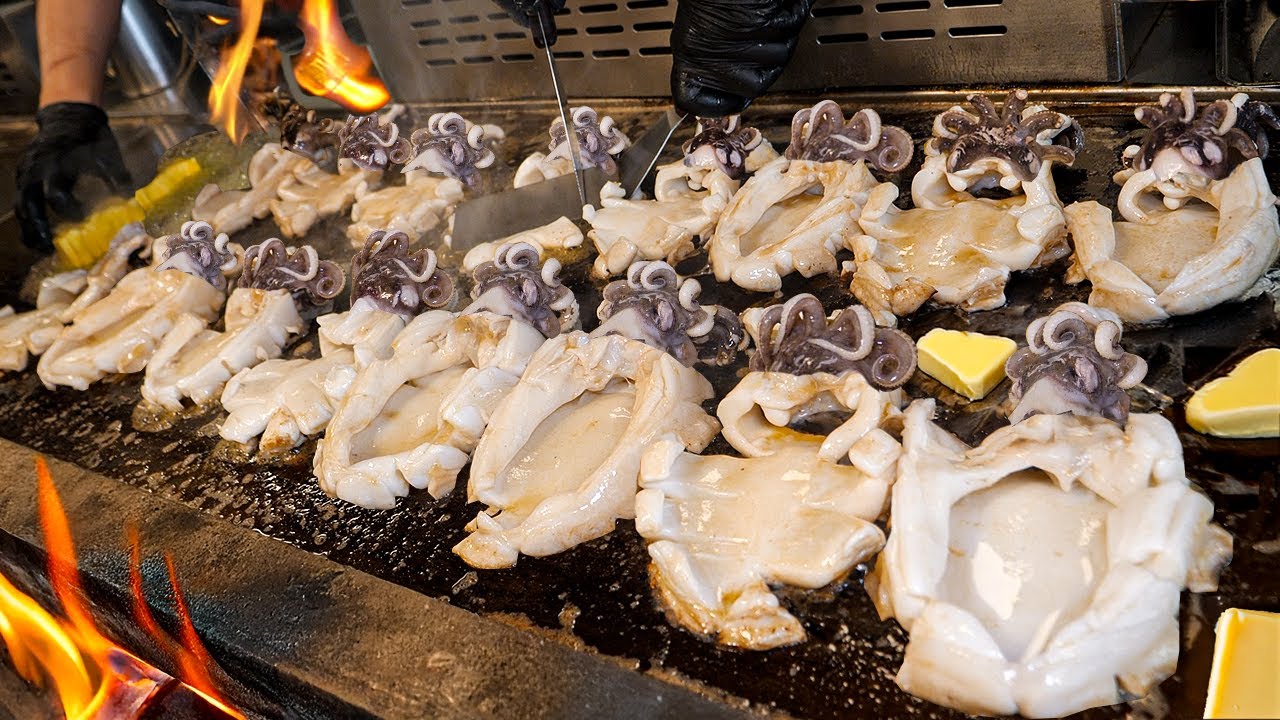 Безумные теппаньяки из морепродуктов на огромной железной тарелк -  корейская уличная еда