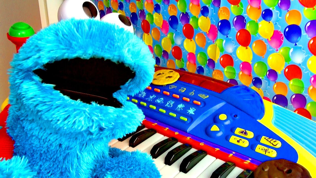 Cookie Monster Plays Piano -- stay for a FUN ending when Cookie Monster sings with the piano!