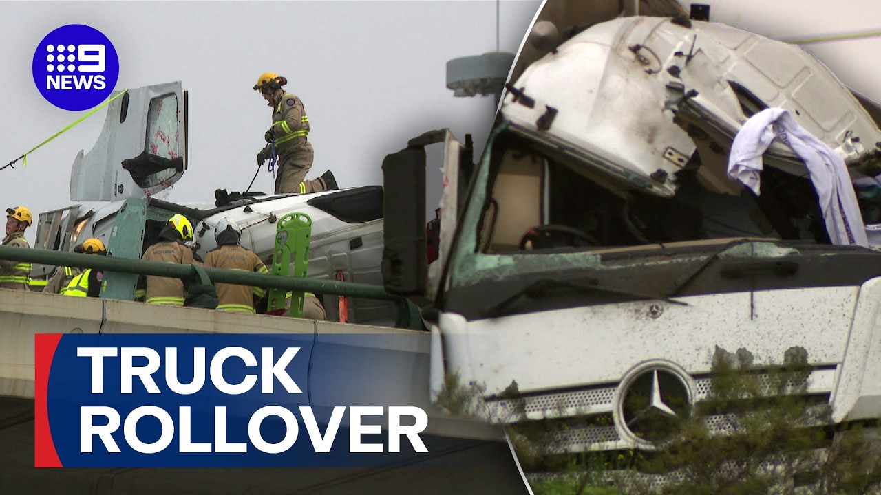 Two injured after truck rolls over at major junction | 9 News Australia