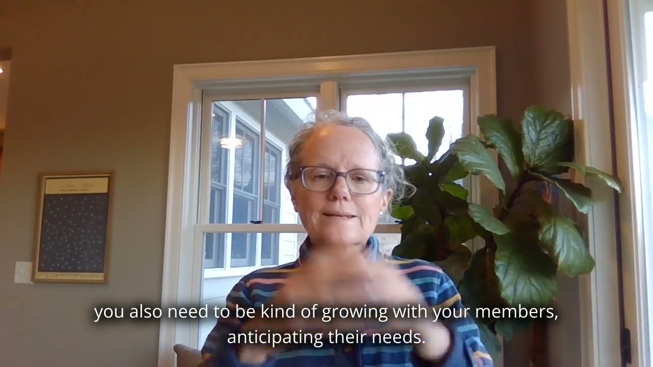 How does a successful cooperative engage members?