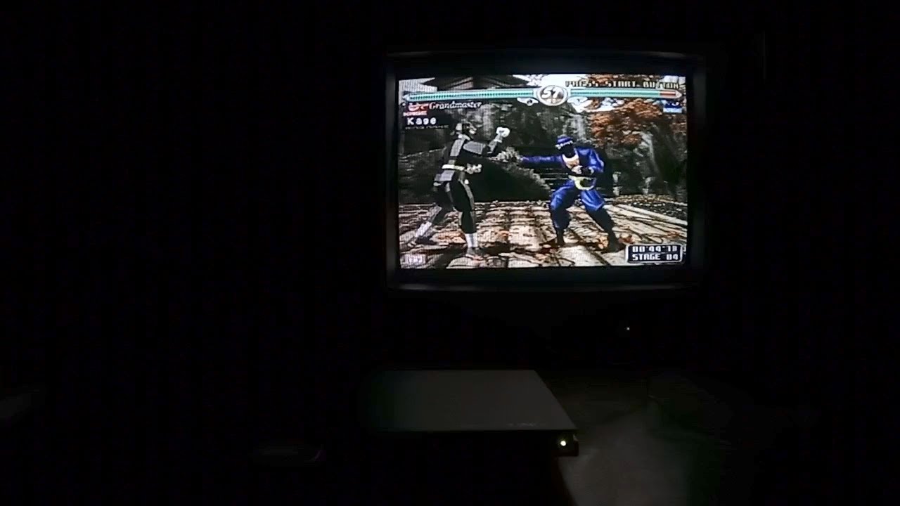 Sandrock Jr. plays the PlayStation 2 edition of Virtua Fighter 4