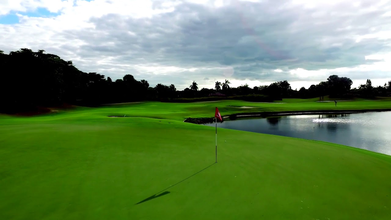 golf course with sand and water features by aerial drone