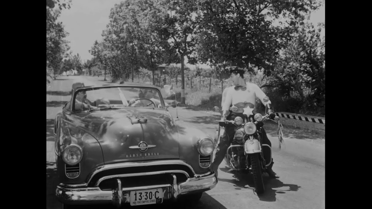 Un americano a Roma. Informazioni al console. Polizia der Kansas City&hellip; orait orait&hellip; awanagana&hellip;