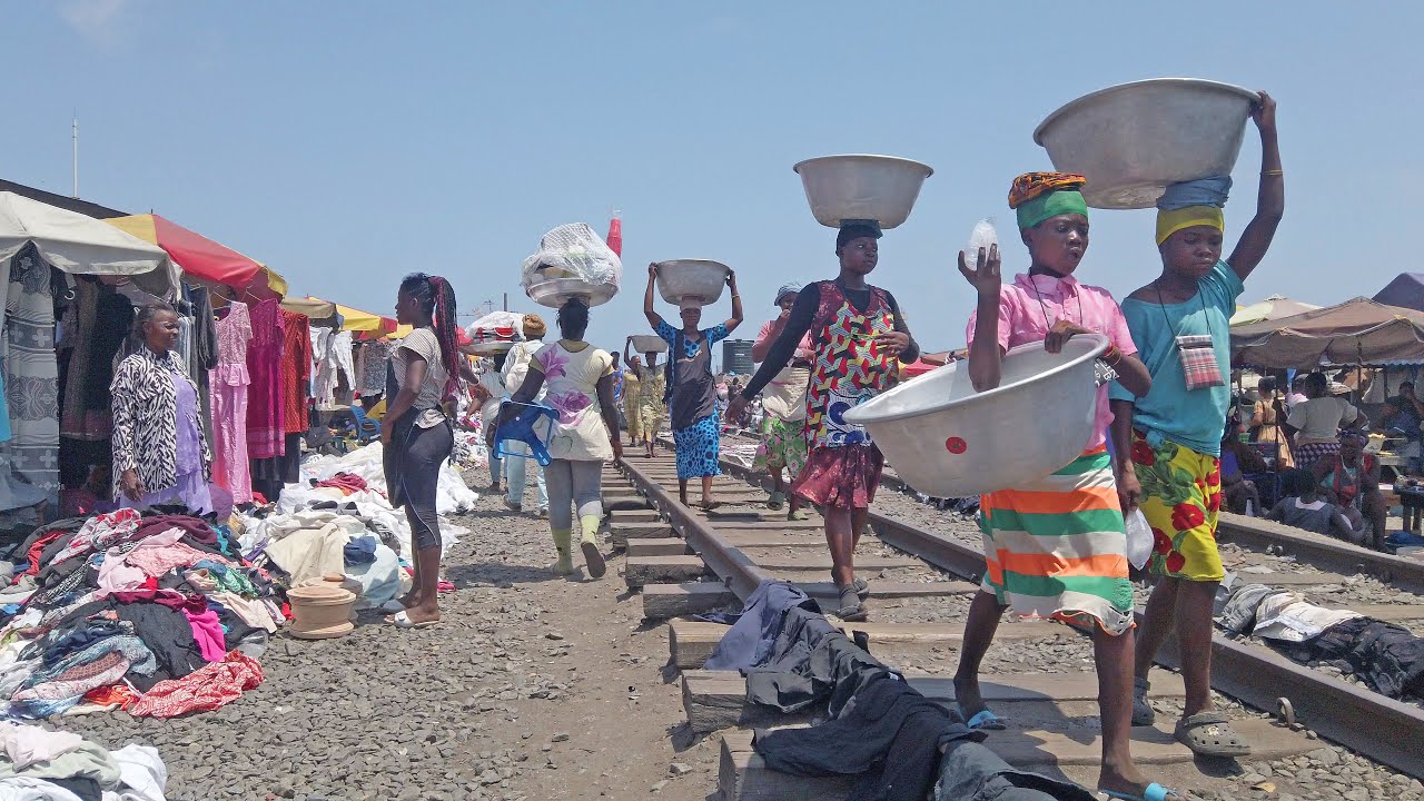 4K TRAIN TRACKS MARKET IN GHANA ACCRA AGBOBLOSHIE, AFRICA