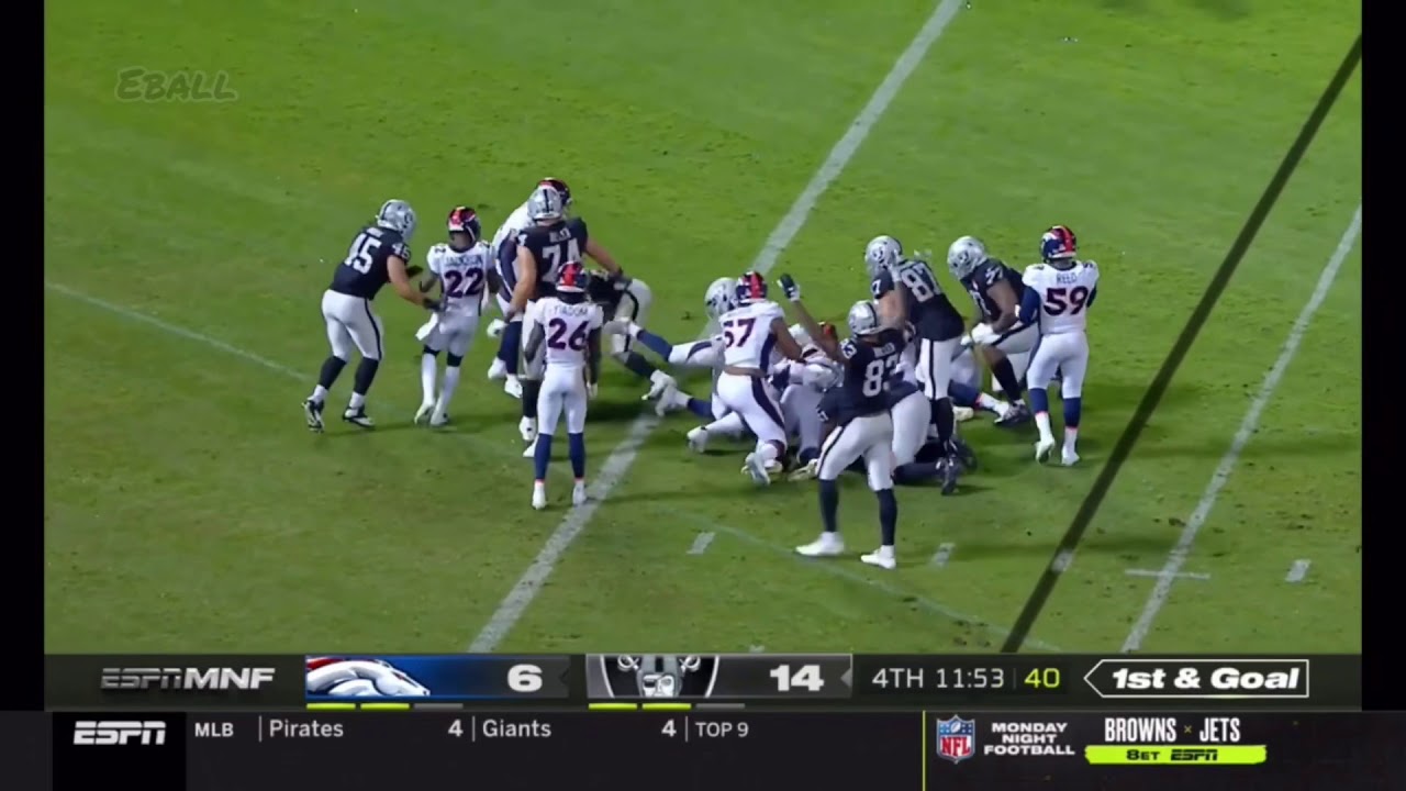 Josh Jacobs bowls over Broncos defenders on his way to second TD run