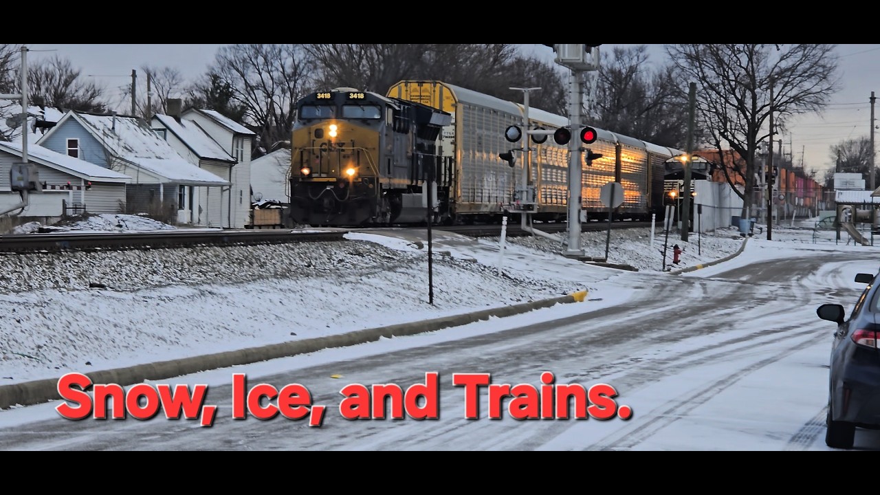 Snow and Ice Coats the Area as Trains Roll On