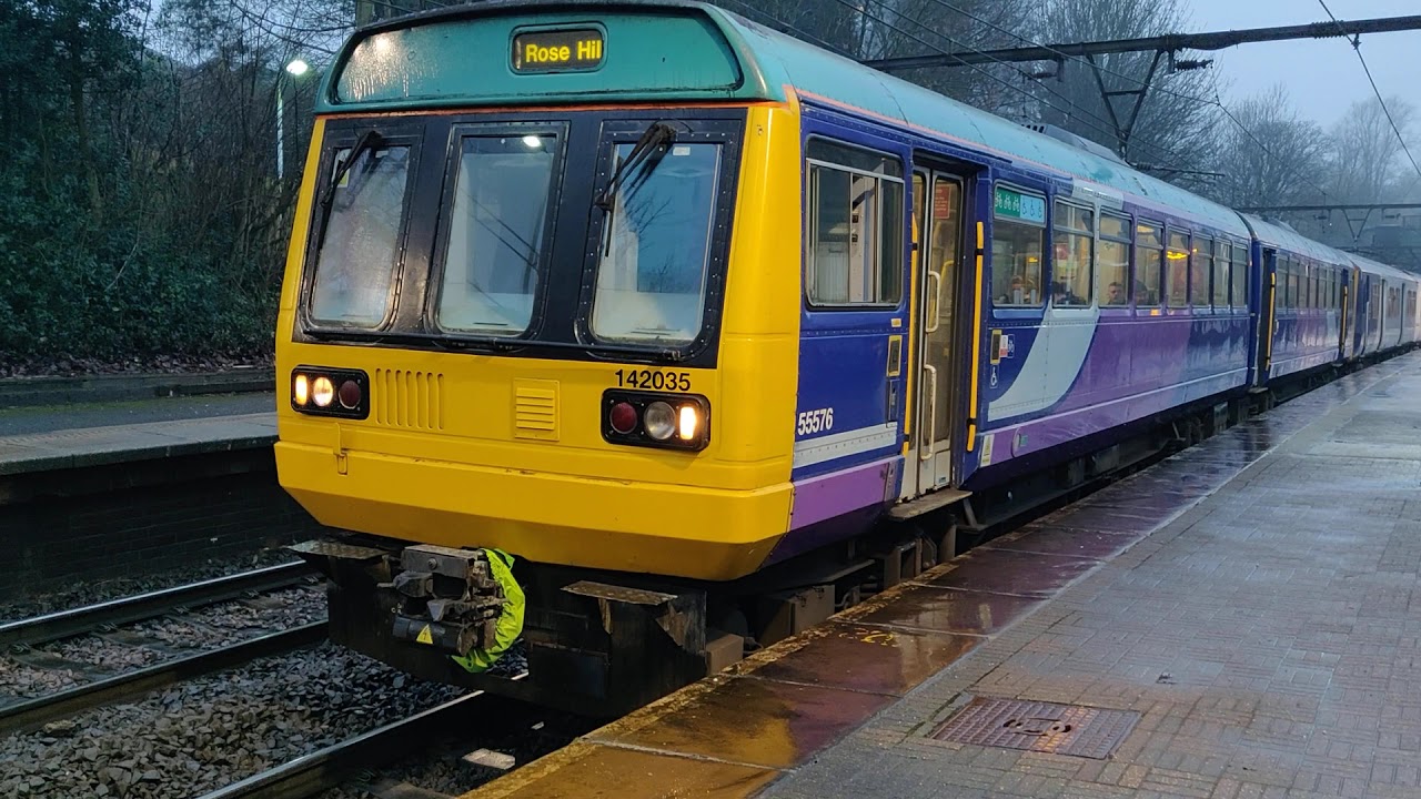 Northern 142035 and 150224 depart Gorton