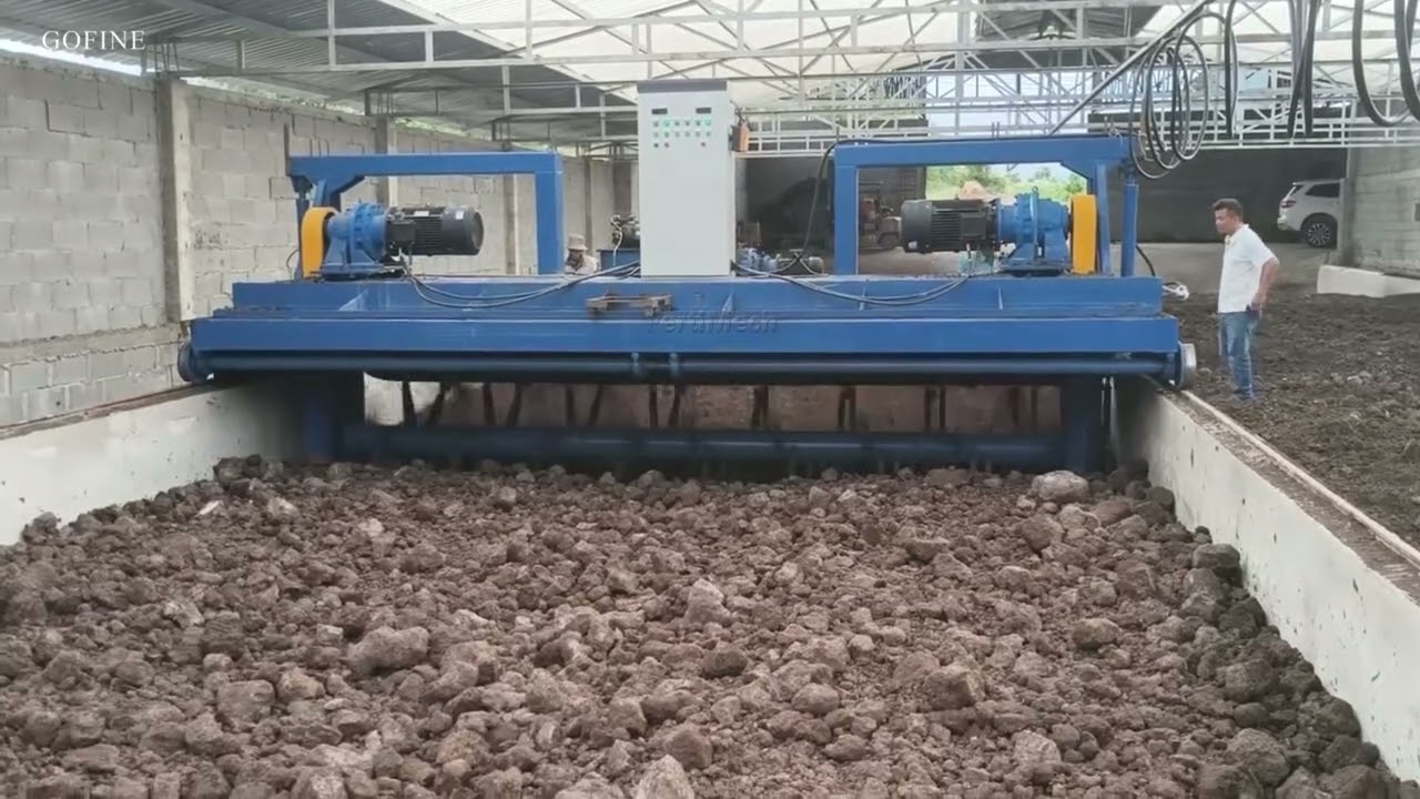 Trough-type compost turning machine, composting machine, compost turner working site.