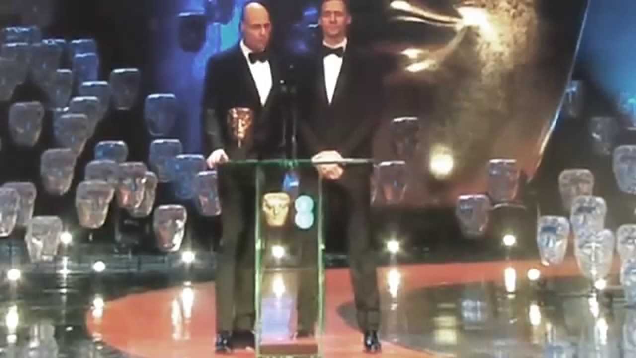 Tom Hiddleston and Mark Strong presenting an Award at BAFTA 2015