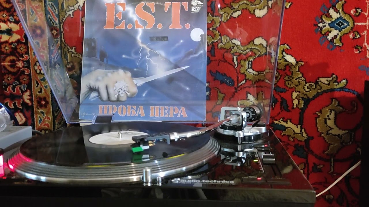 E. S. T. 
