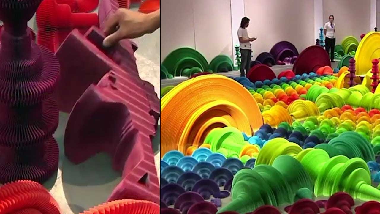 Chinese artist makes colorful paper guns that turn to flowers