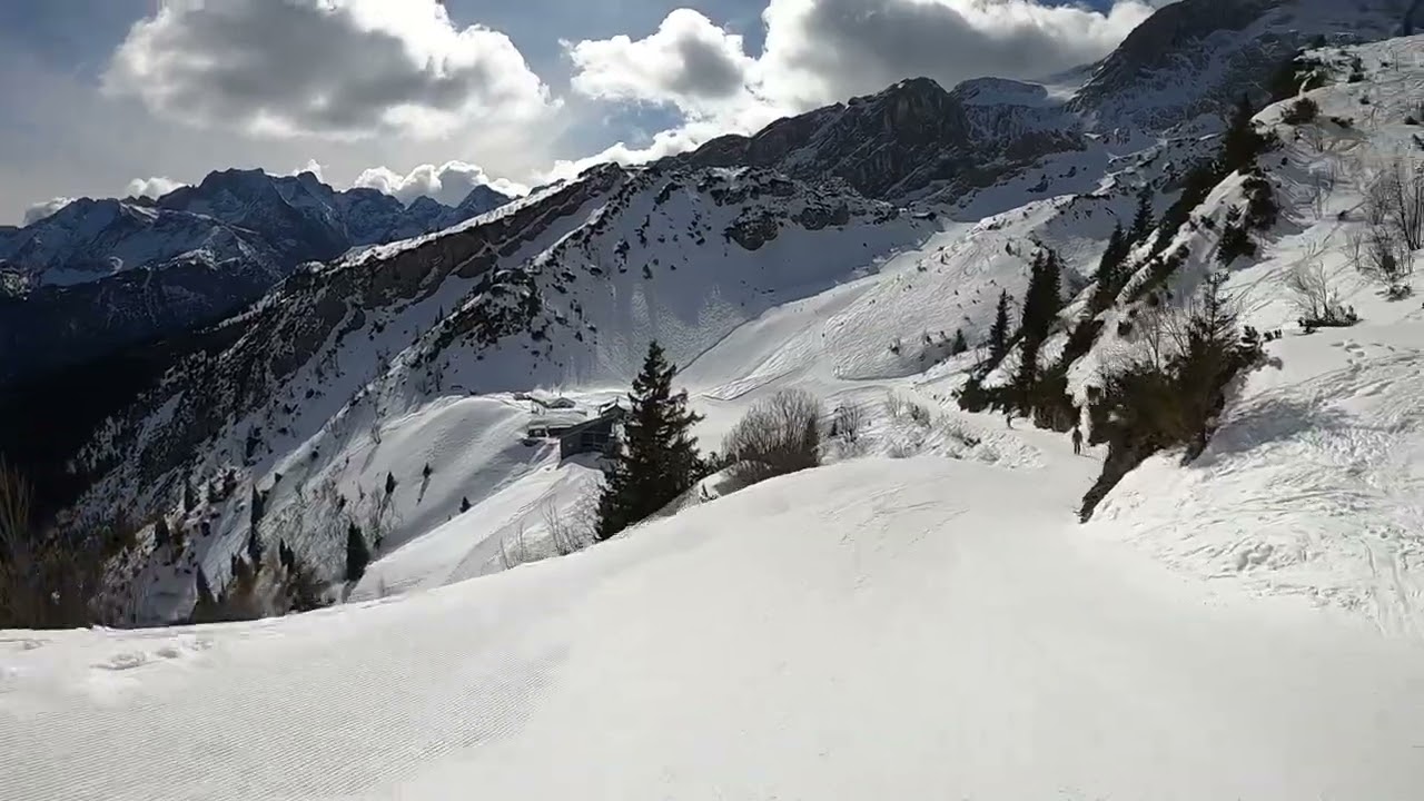 Skiing at Garmisch-Classic Slope 18 Red on a sunny and quiet day