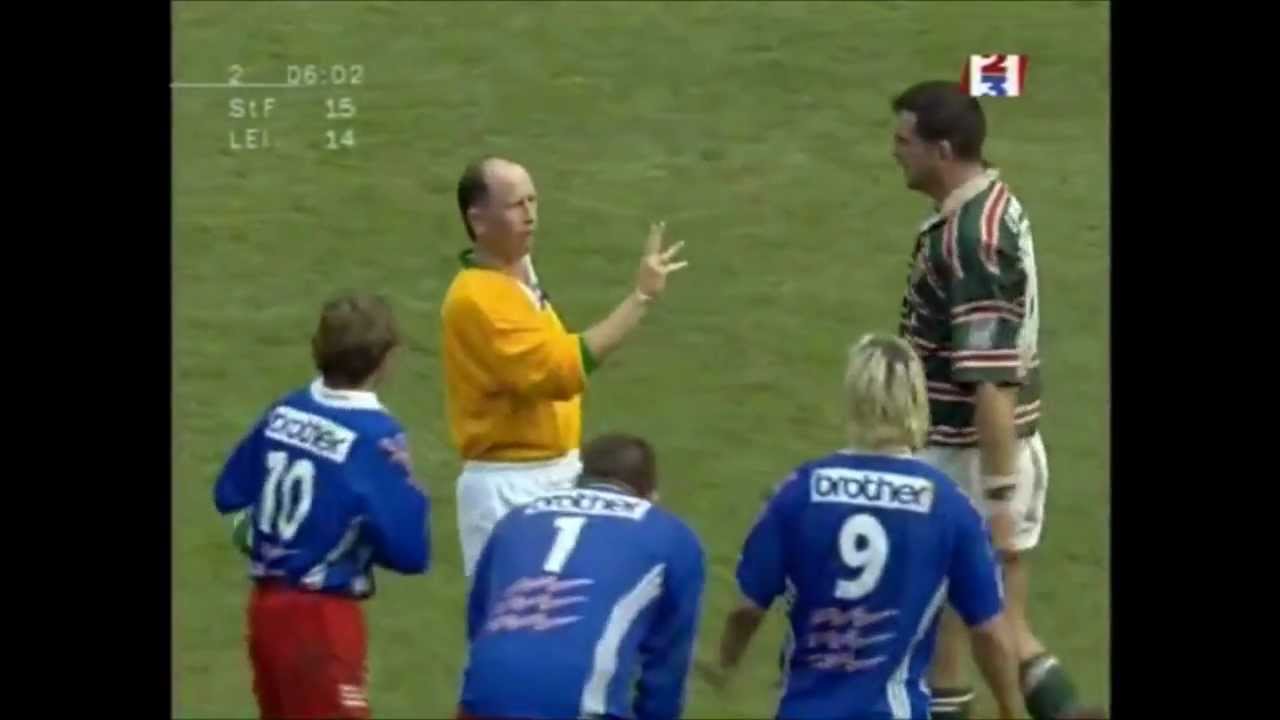Martin Johnson strikes Christophe Juillet in the face