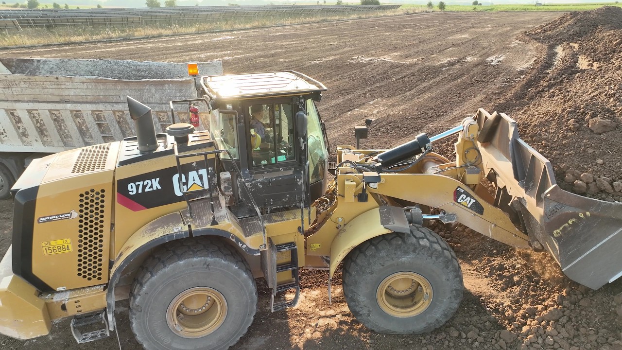 Cat 972K Wheel Loader Loading Soil On Trucks - 4k Drone Footage - Sotiriadis/Labrianidis