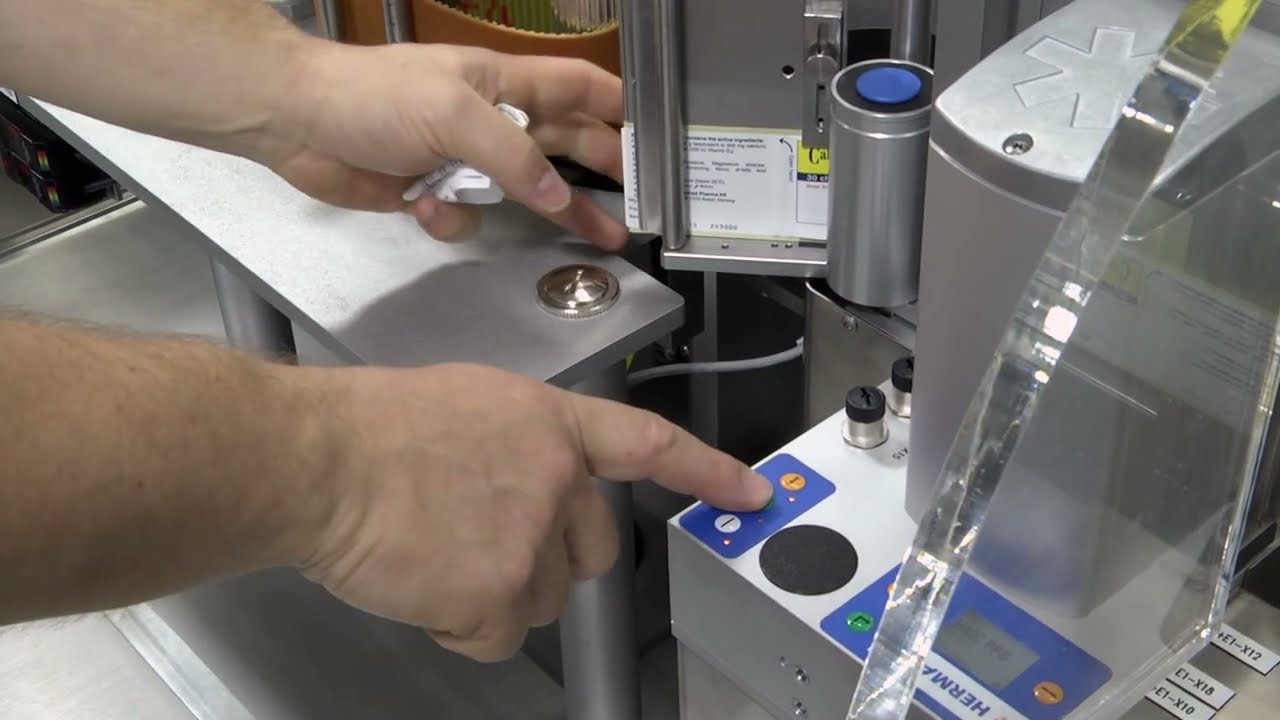Exile Technology HERMA 132M HC   Wrap around labelling machine, designed for the healthcare industry