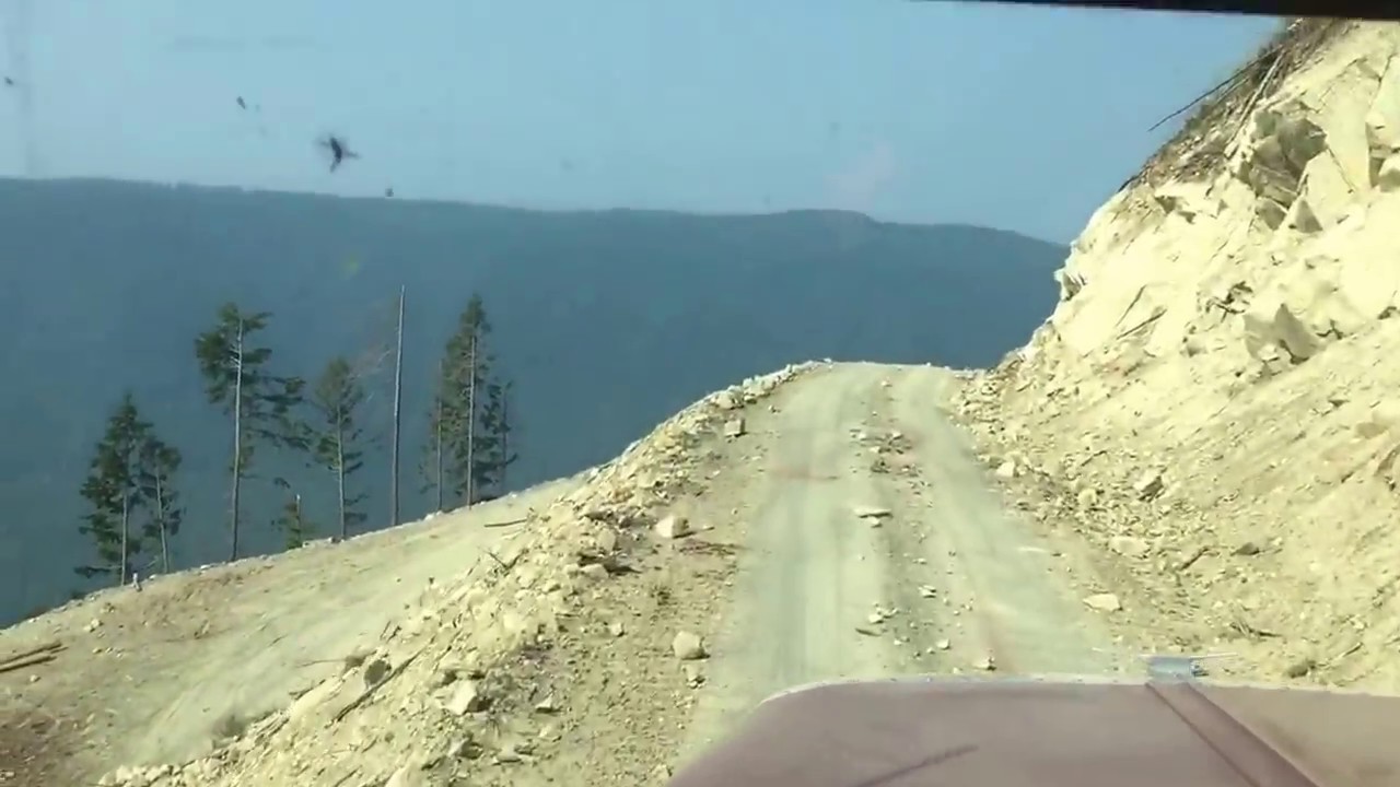 Peterbilt logging truck coming off cliff with load in Bellingham,Wa.