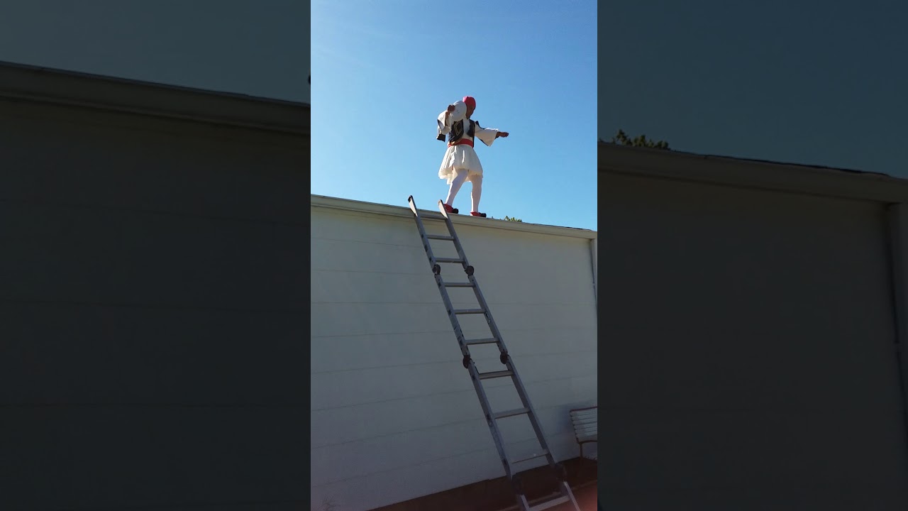 Dancing on the roof with a greek costume.